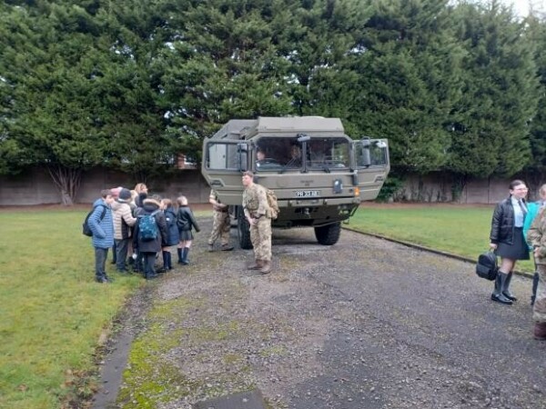 20230216 081929.jpg.article 620 Pupils climbing into a military truck at the Barracks
