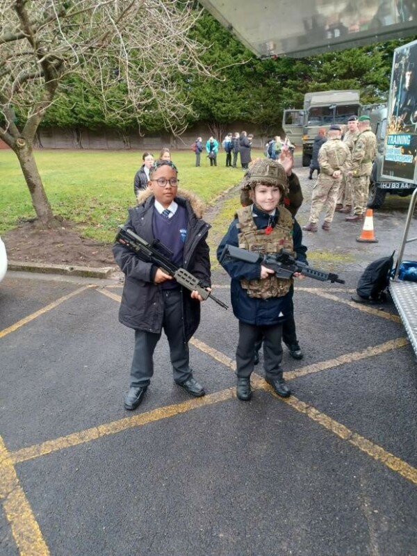 20230216 082408.jpg.article 620 Children pictured holding unarmed firearms