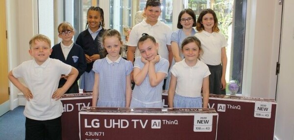 Amazon TV donation 702x336 Children pictured with LG TVs that were donated to their school by Gleave and Amazon