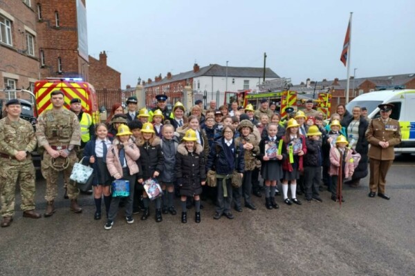 Barracks walk ft img.png.article 962 Beamont pupils pictured with service people and vehicles at Peninsula Barracks