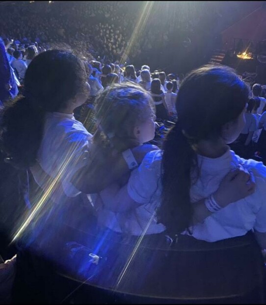 Beamont choir.jpg.article 620 Children pictured with their arms around eachother, performing at AO Arena