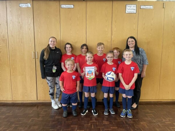 FrodshamPE gold.jpeg.article 962 Mrs Callaghan and Miss Pemberton with some of Frodsham's sports stars!